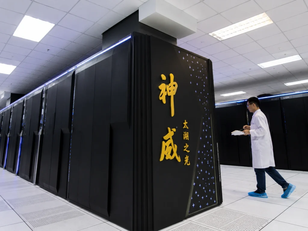 A server room corridor inside a high-tech data center featuring row cabinets of China supercomputer architecture.